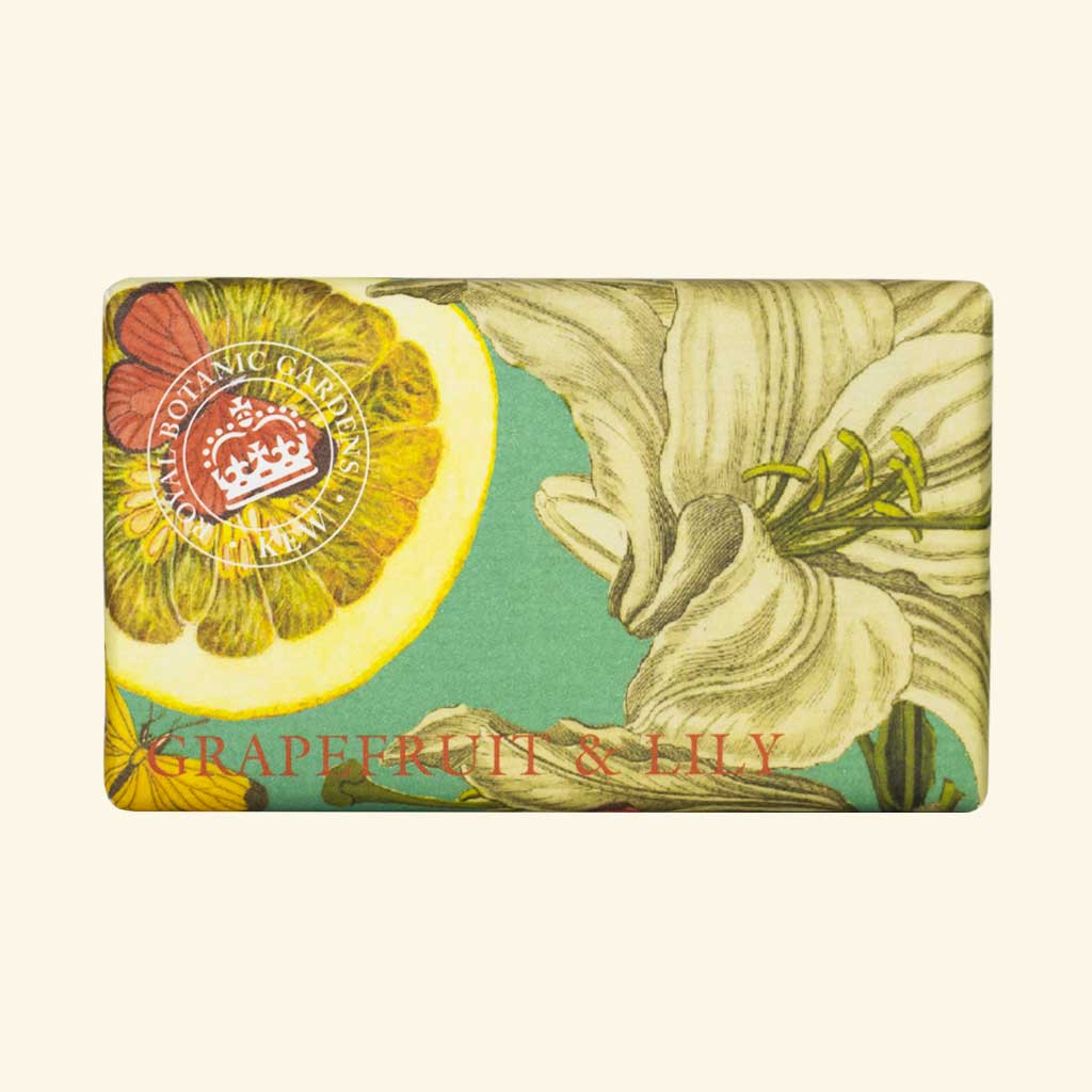 “Seife in edlem Papier mit botanischem Design aus Grapefruit und Lilien auf grünem Hintergrund, Text: Grapefruit & Lily.”