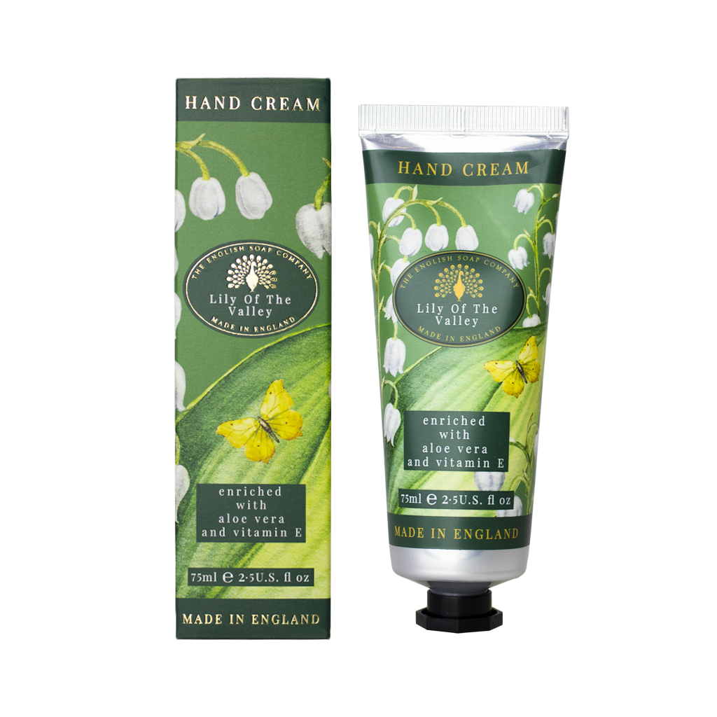 “Handcreme ‘Lily of the Valley’ mit Maiglöckchenmotiv und Verpackung, beide in Grüntönen mit gelbem Schmetterling.”